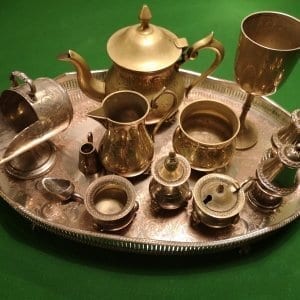Selection of brass & silver items on a silver tray