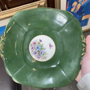 Green plate with flowers